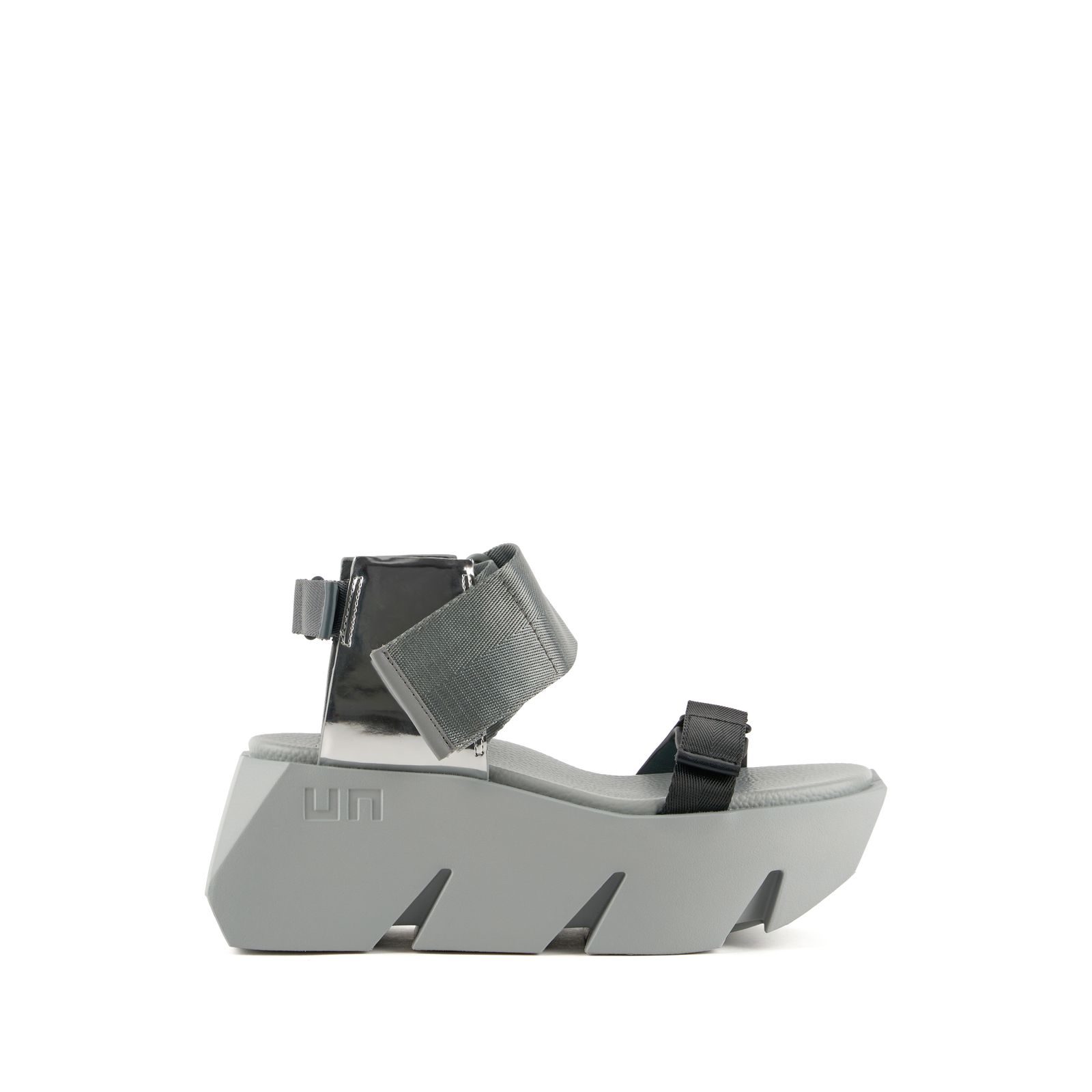 a woman's grey platform sandal with two straps