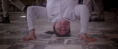 a man is upside down on the floor