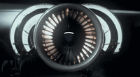 a close up of a jet engine in the dark