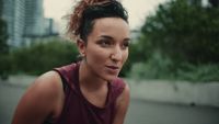 a close up of a person wearing a tank top