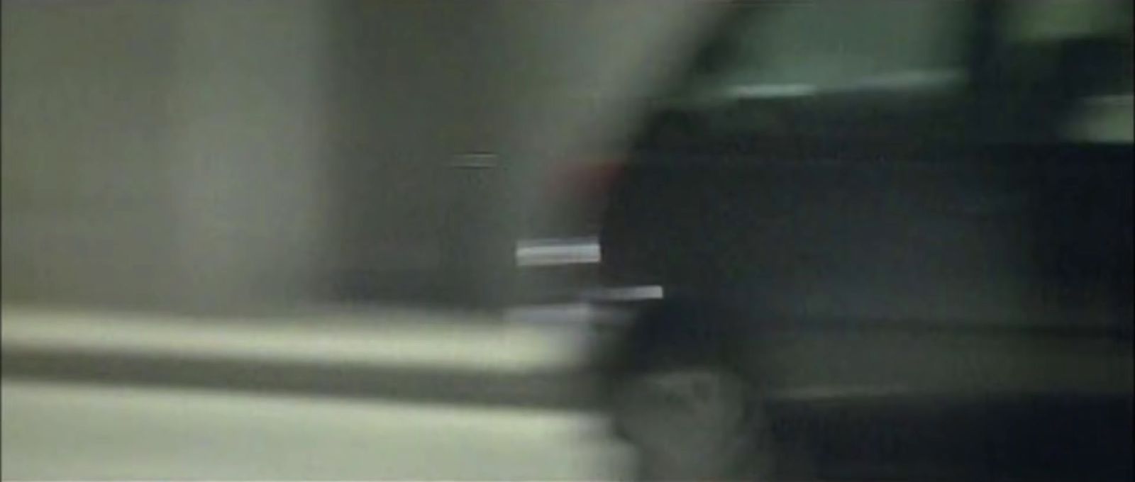 a blurry photo of a car with the door open