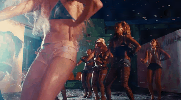 a group of women standing around each other