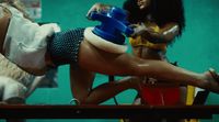 two women in bathing suits are on a table