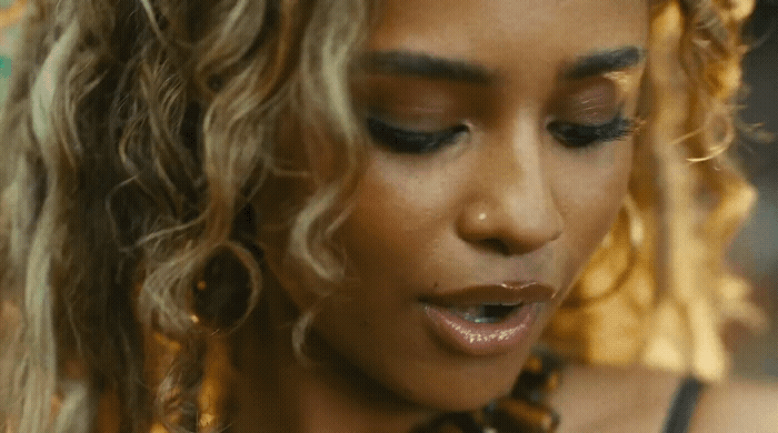 a close up of a person wearing a necklace