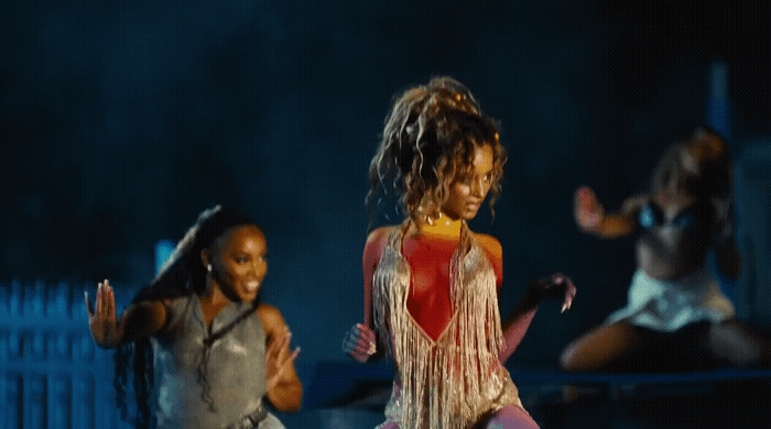 a group of young women dancing on stage