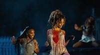 a group of young women dancing on stage