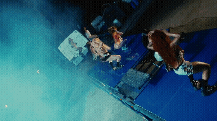 a group of people standing around a stage