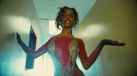 a woman in a red and gold costume