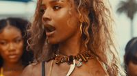 a close up of a person wearing a necklace