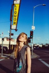 a woman standing in the middle of a street