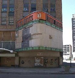 an old building with graffiti on the side of it