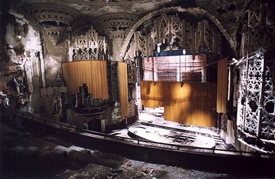 an abandoned theater with a broken down stage