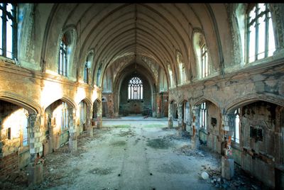 an abandoned building with a lot of windows