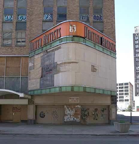 a large building with graffiti on the side of it