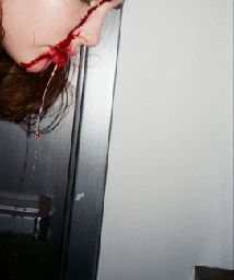 a woman with her head in the door of a room