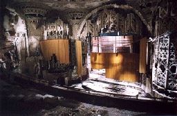 an old theater with a lot of wooden doors