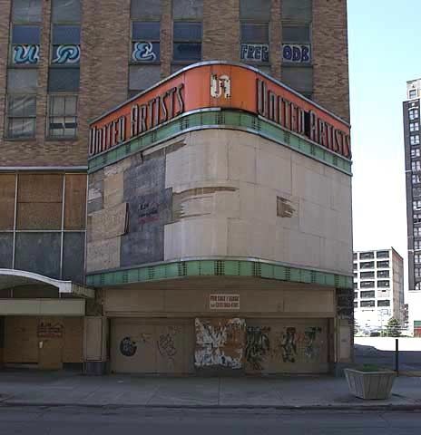 a large building with graffiti on the side of it