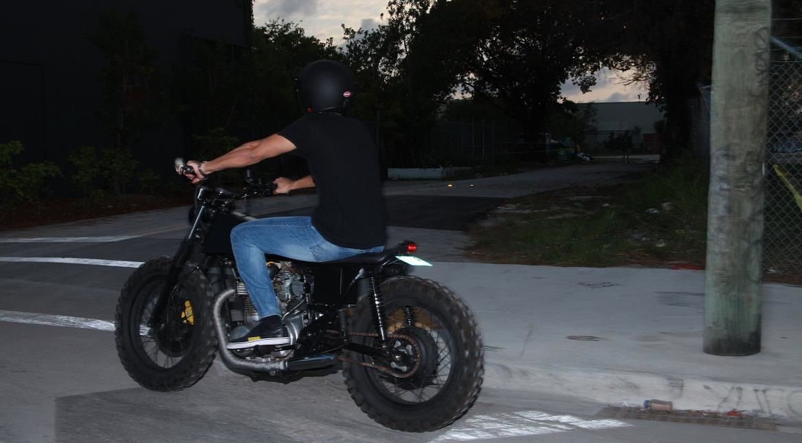 a man riding on the back of a motorcycle