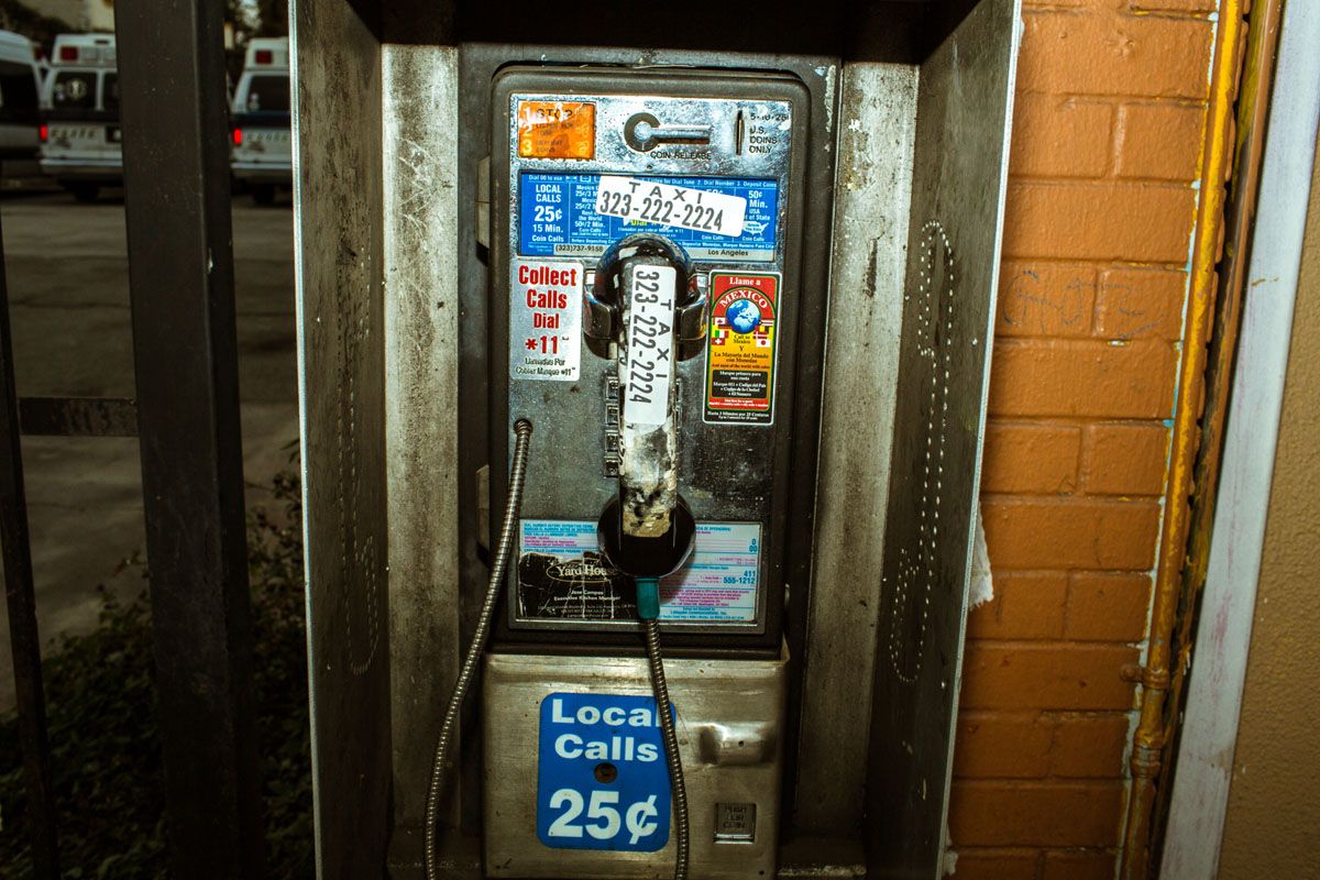 an old pay phone with a price tag on it