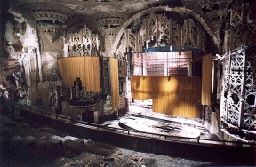 an old theater with a wooden door