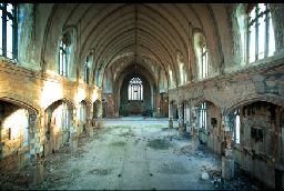 an old abandoned building with a lot of windows