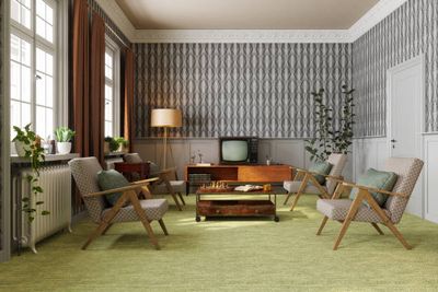 a living room filled with furniture and a tv