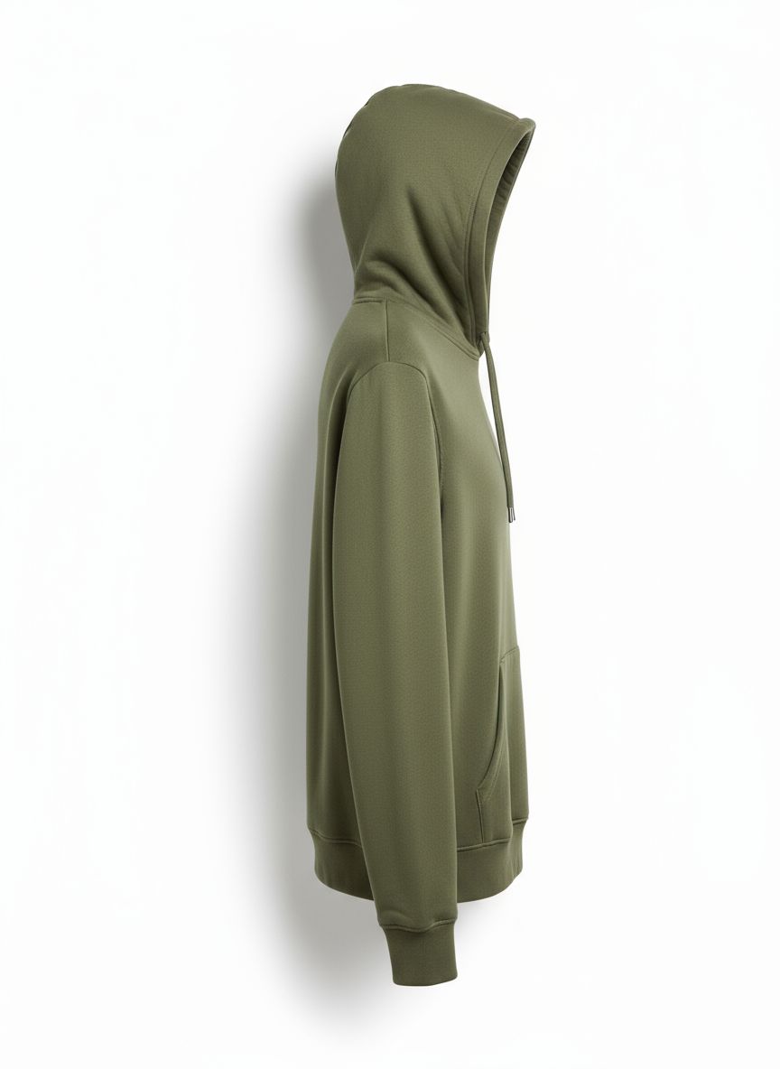 a green hoodie hanging on a white wall