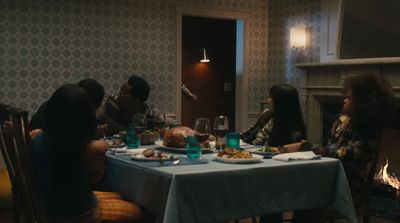 a group of people sitting around a dinner table