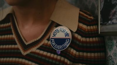 a close up of a person wearing a badge