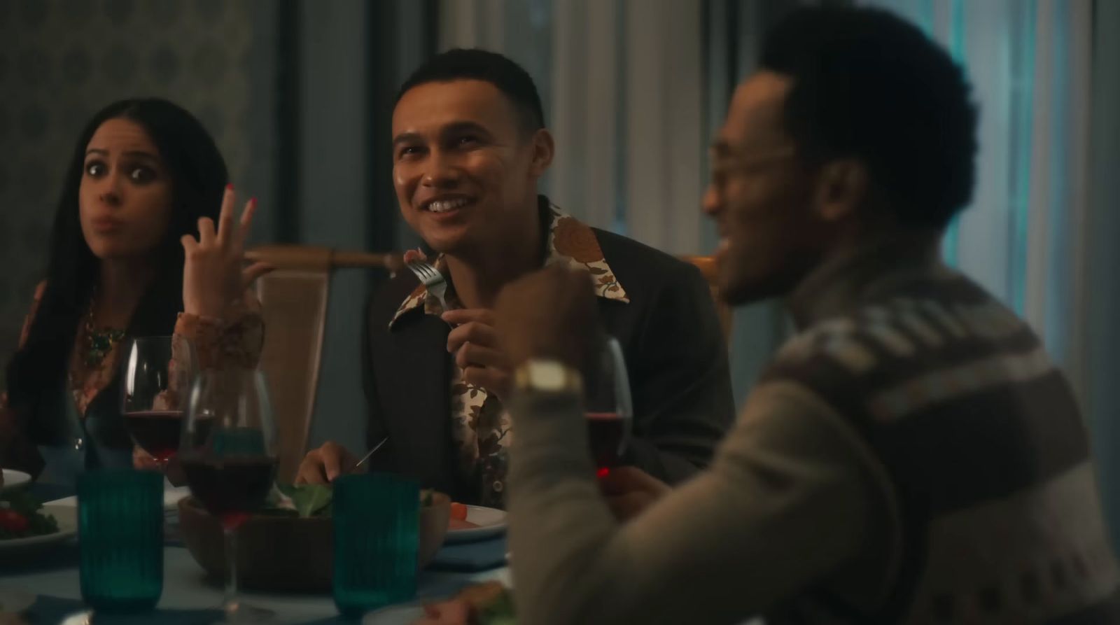 a group of people sitting around a dinner table