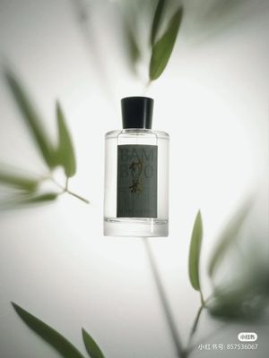 a bottle of perfume sitting on top of a table