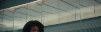 a blurry photo of a woman with a cell phone