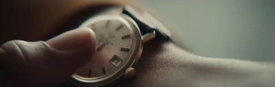 a close up of a person holding a watch