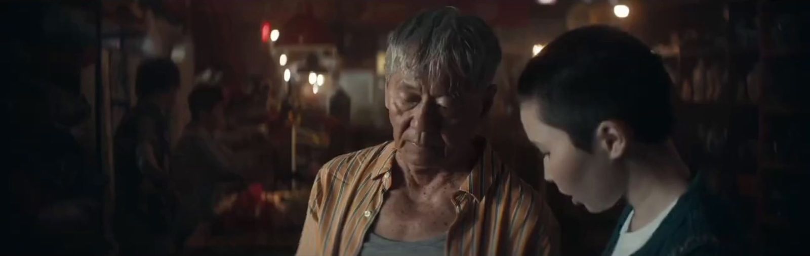 a woman standing next to a man in a room