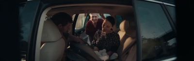 a group of people sitting in the back of a car