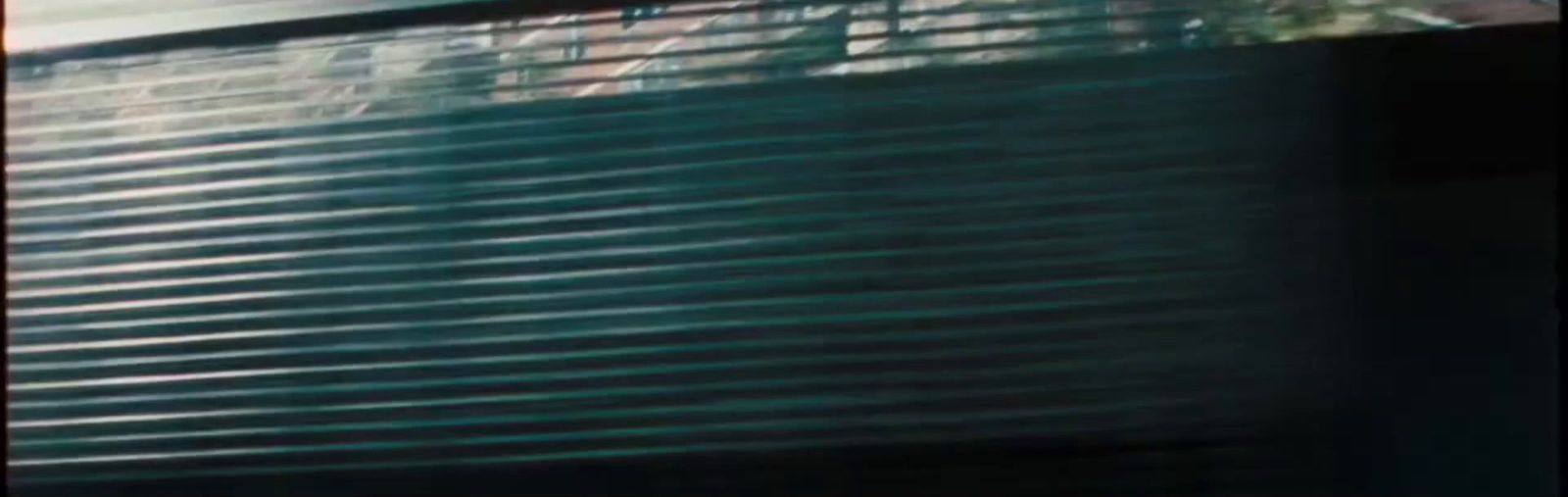 a blurry image of a building with a clock on it