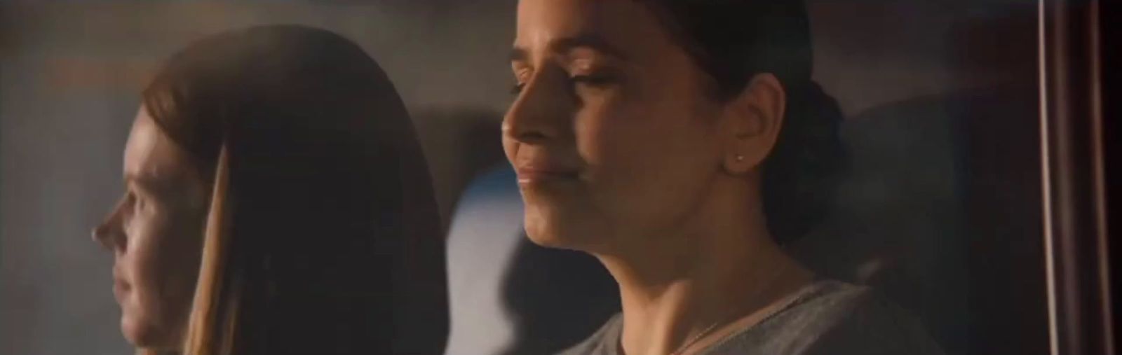 a woman looking at herself in a mirror