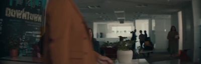 a group of people walking down a hallway