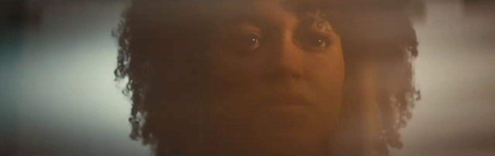 a blurry photo of a woman's face