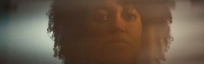 a blurry photo of a woman's face