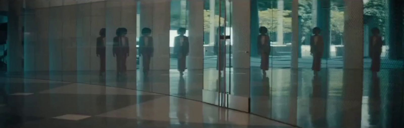 a group of people standing in front of a building