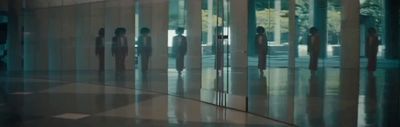 a group of people standing in front of a building