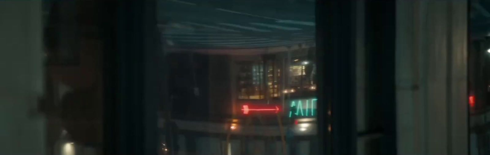 a blurry photo of a city street at night