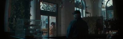 a man standing in front of a building at night