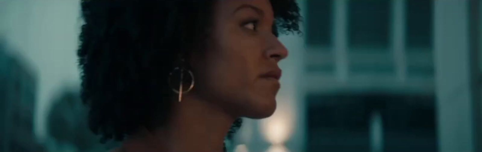a close up of a person wearing earrings