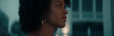 a close up of a person wearing earrings