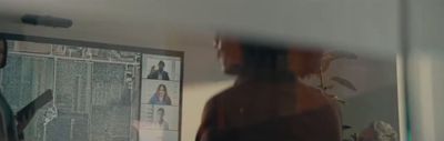 a man standing in front of a mirror in a room