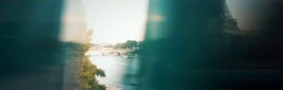 a blurry photo of a city street and a river