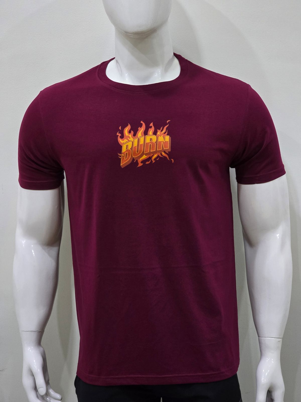 a mannequin wearing a red shirt with flames on it