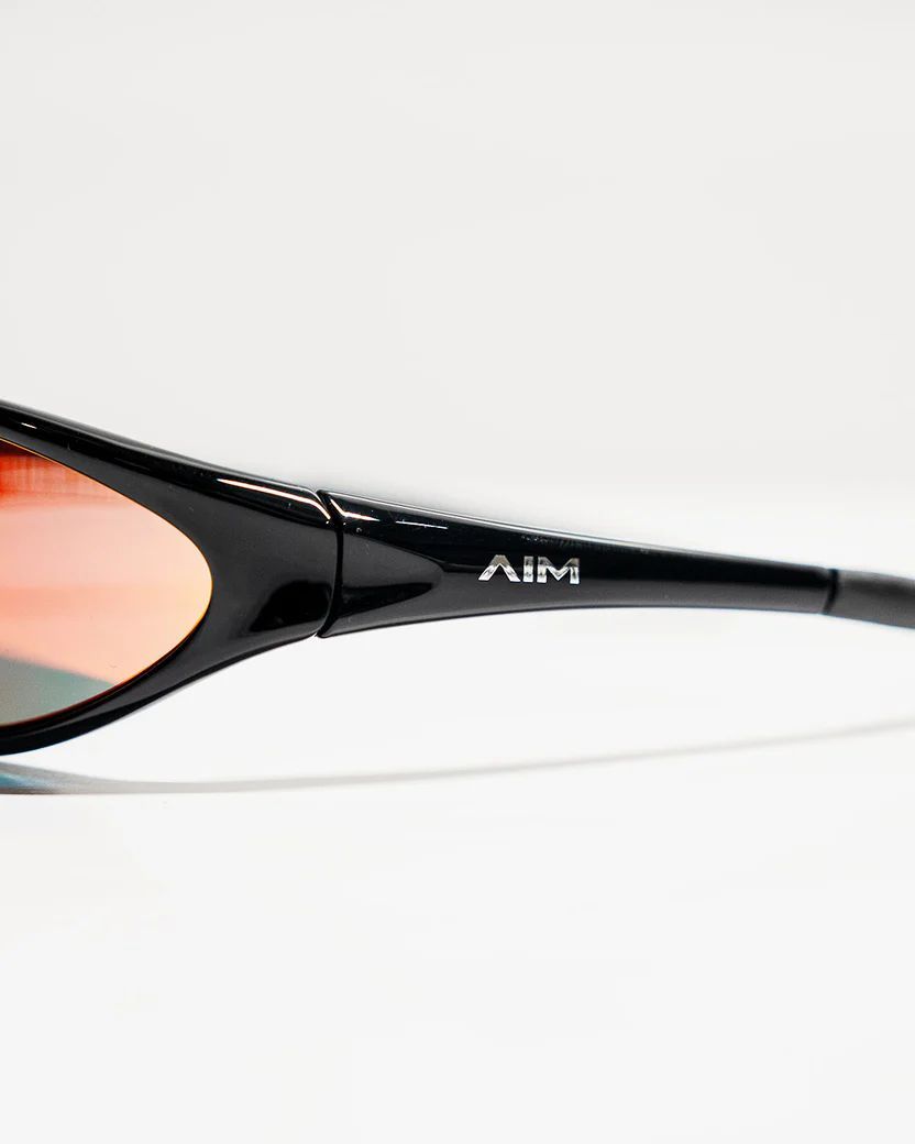 a pair of sunglasses sitting on top of a white table